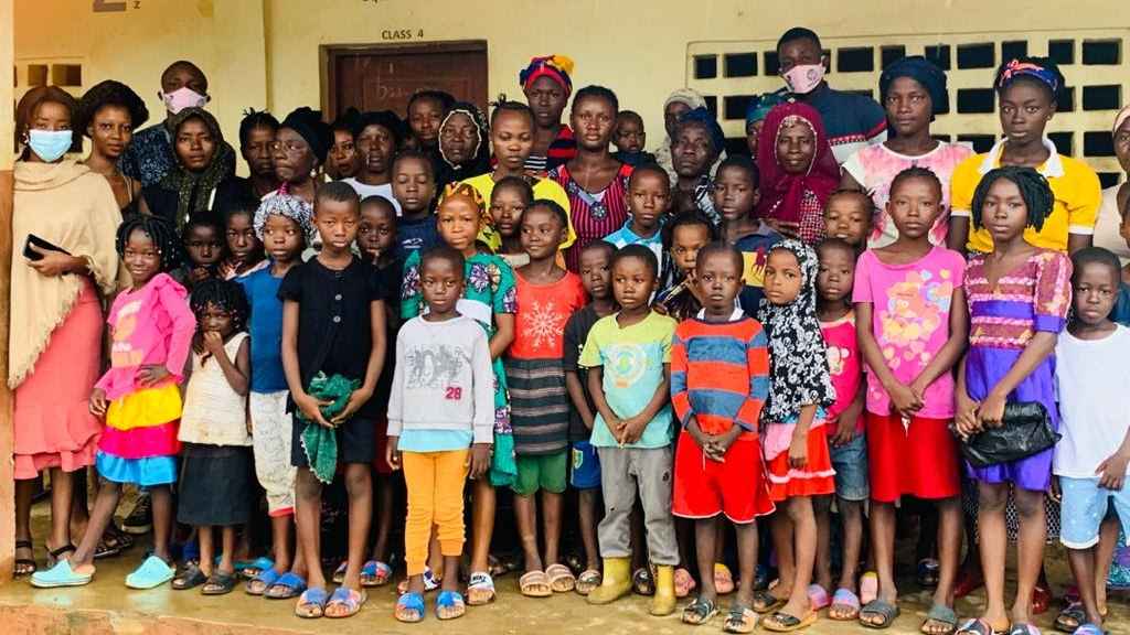 Underprivileged children going through verification process for donation of learning materials 