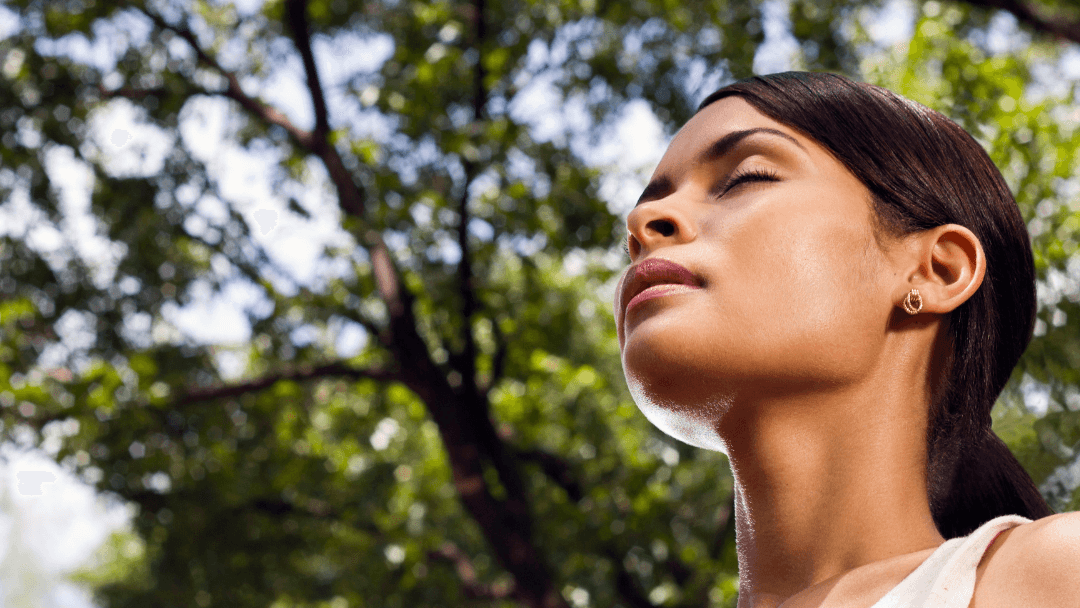woman at peace with herself, inhaling.