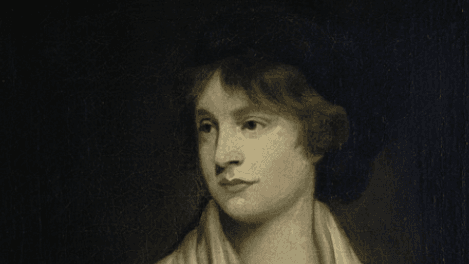 A painting of the philosopher and writer Mary Wollstonecraft. She is light skinned, with brown hair and is against a dark background.