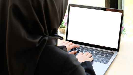 A girl working on the laptop