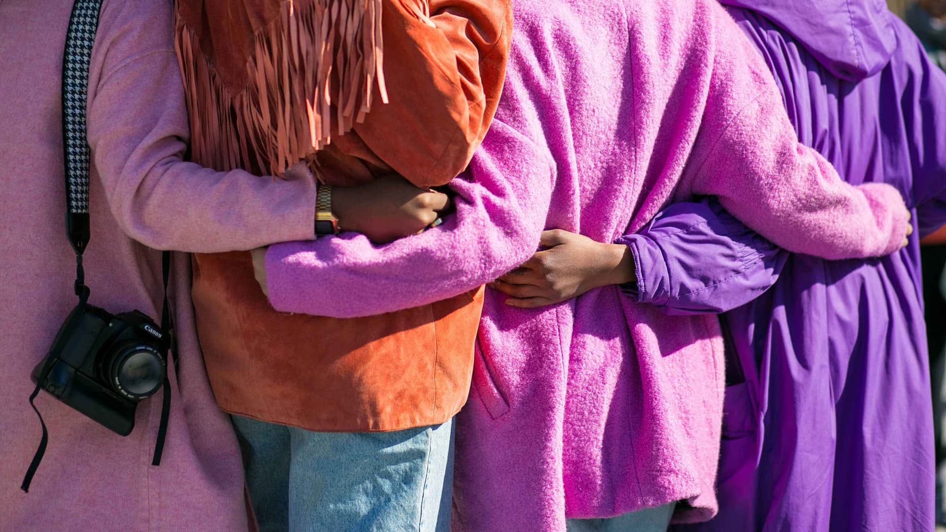 Women embracing together