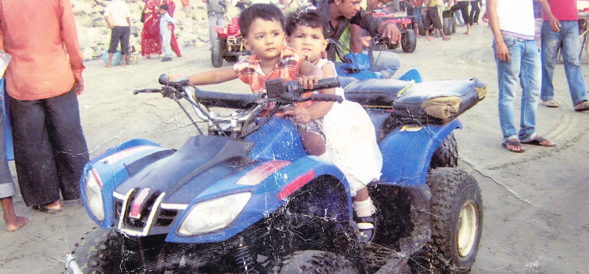 A childhood photo of my twin son and daughter standing together and smiling. This photo was taken during their early years and represents the beginning of my motherhood journey.